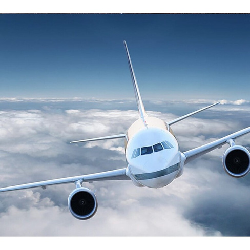 Фотообои Студия фотообоев Летящий над облаками самолет